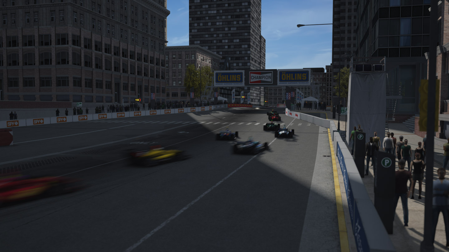 Capture d'écran du jeu Assetto Corsa montrant plusieurs Indy lights se suivant sur un circuit fictif situé dans les rues de Chicago.